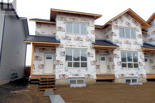 Freehold Townhouse for Sale, 26 Lake Street, Rural Red Deer County, AB